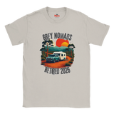 An Ice Grey crewneck t-shirt featuring a retro-style graphic of a camper trailer and truck on a dirt road with a sunset, accompanied by the text 'GREY NOMADS RETIRED 2026'. The inner collar shows the 'Myths' brand logo.