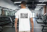 Man wearing a white t-shirt with 'OUTWORK EVERYONE' text on the back, standing against a white background.