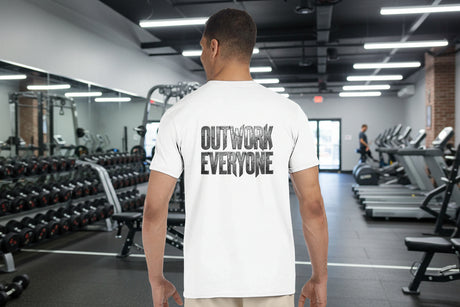 Man wearing a white t-shirt with 'OUTWORK EVERYONE' text on the back, standing against a white background.