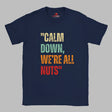 A Flat lay view of a navy colored retro-style casual tee featuring bold distressed vintage typography reading “Relax — We’re All Weird Here,” printed on ultra-soft Gildan 64000 cotton.

