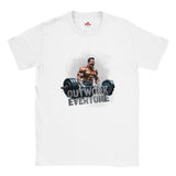 White t-shirt with a graphic of a muscular man lifting weights and text 'OUTWORK EVERYONE' on a white background.