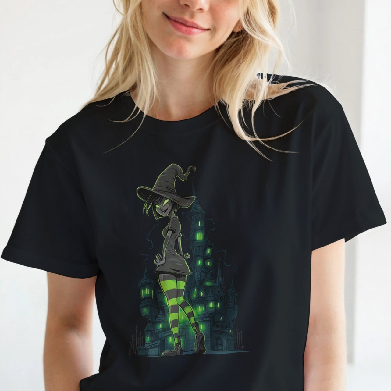 Woman wearing a black t-shirt with a graphic design, standing indoors.