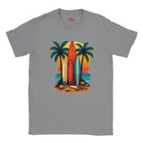 Gray t-shirt with a colorful graphic of surfboards and palm trees on a white background