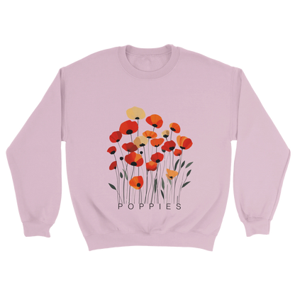 A Pink sweatshirt featuring a minimalist poppy flower design. The graphic displays red, orange, and muted gold poppies with slender stems and leaves, and the word “POPPiES” printed beneath. The cozy, casual outfit has a soft, modern aesthetic ideal for floral and nature-inspired fashion.