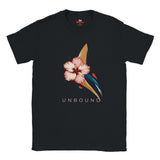 Black UNBOUND hibiscus graphic T-shirt with pink flower and abstract navy and gold design photographed on a grey studio background.