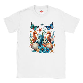 A white graphic T-shirt featuring three colourful seahorses, blue butterflies, tropical flowers, starfish and seashells in a vibrant ocean wildlife design.