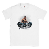 White t-shirt with a graphic of a muscular man lifting weights and text 'OUTWORK EVERYONE' on a white background.