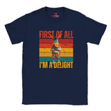 Casual navy tee displaying a retro-style donkey illustration with bold “First of All, I’m a Delight” vintage text, on a white background