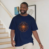 Man wearing a navy blue t-shirt with a sunflower design in a home setting