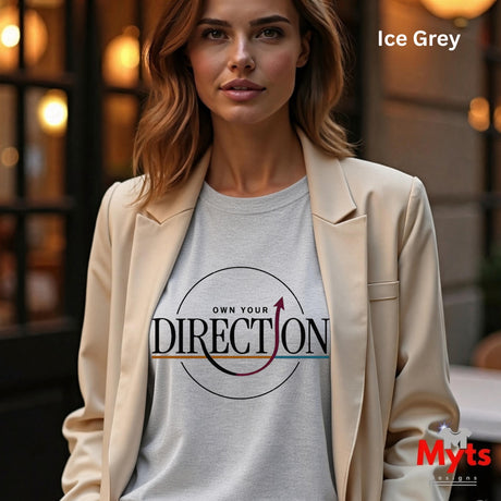 A woman wearing a light gray graphic t-shirt under a beige blazer, with the text 'Ice Grey' in the top right and a 'Myts' watermark in the bottom right.