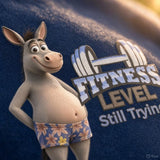 Close-up of donkey character and dumbbell graphic printed on Navy Fitness Level Still Trying T-shirt.