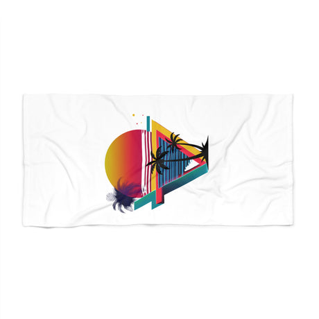 A white beach towel featuring a colorful retro graphic of a sunset, palm trees, and geometric shapes, displayed flat against a white background.