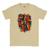 A Sand crewneck t-shirt featuring a colorful graphic print of three stylized faces with eyes, rendered in a vibrant multicolor paint-splatter style.
