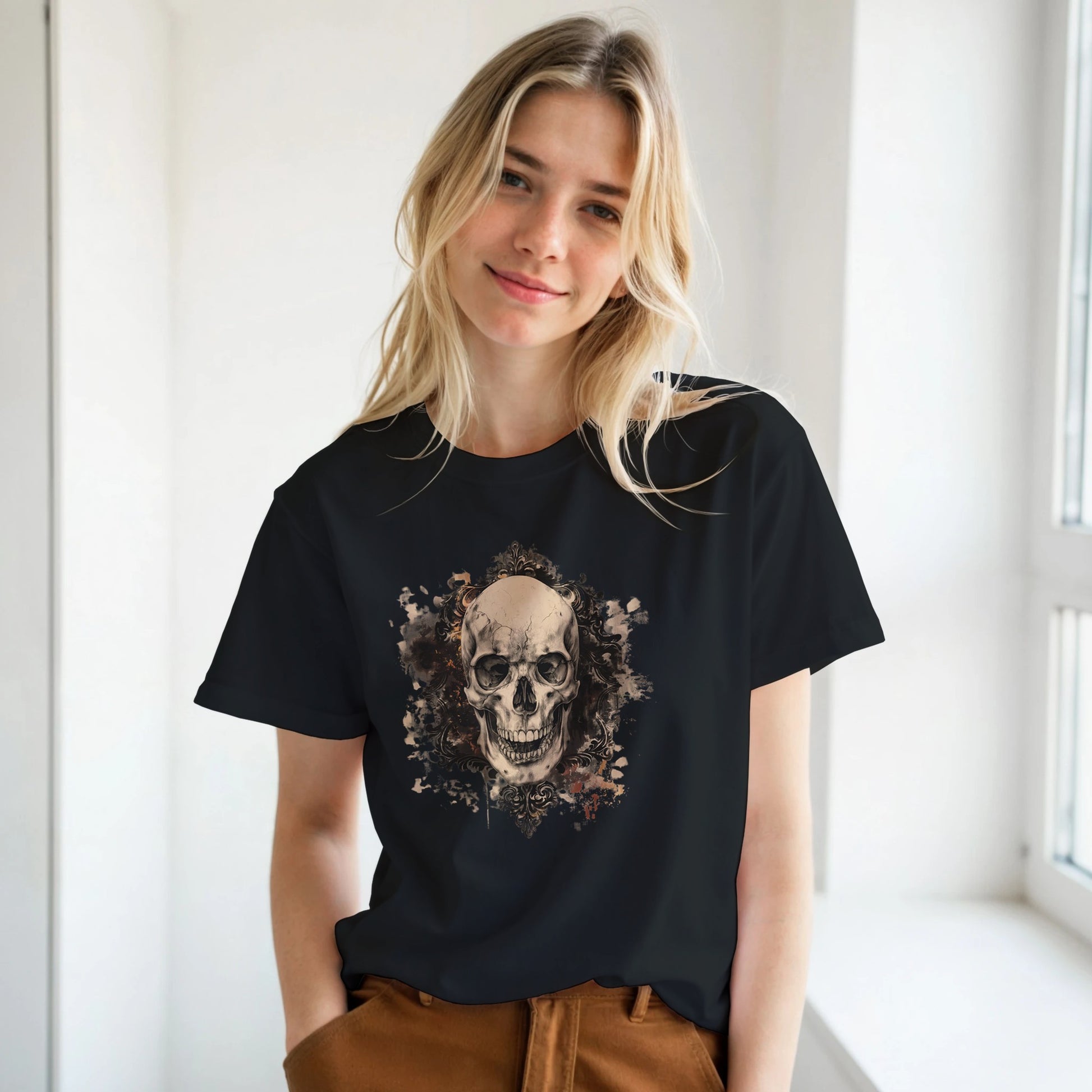 Woman wearing a black t-shirt with a skull design in a room with white walls and a window.