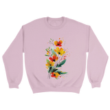 A light pink sweatshirt featuring an artistic watercolor floral design with red, yellow, and orange wildflowers accented by lush green leaves and delicate splatters.

