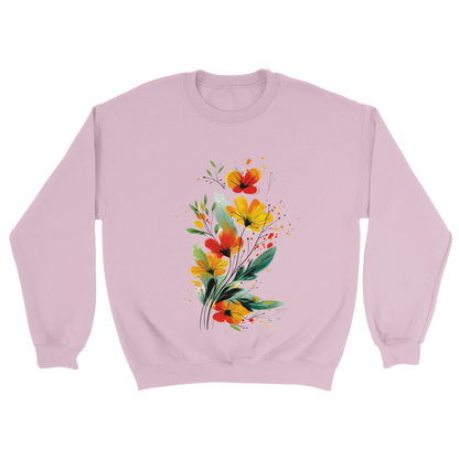 A light pink sweatshirt featuring an artistic watercolor floral design with red, yellow, and orange wildflowers accented by lush green leaves and delicate splatters.


