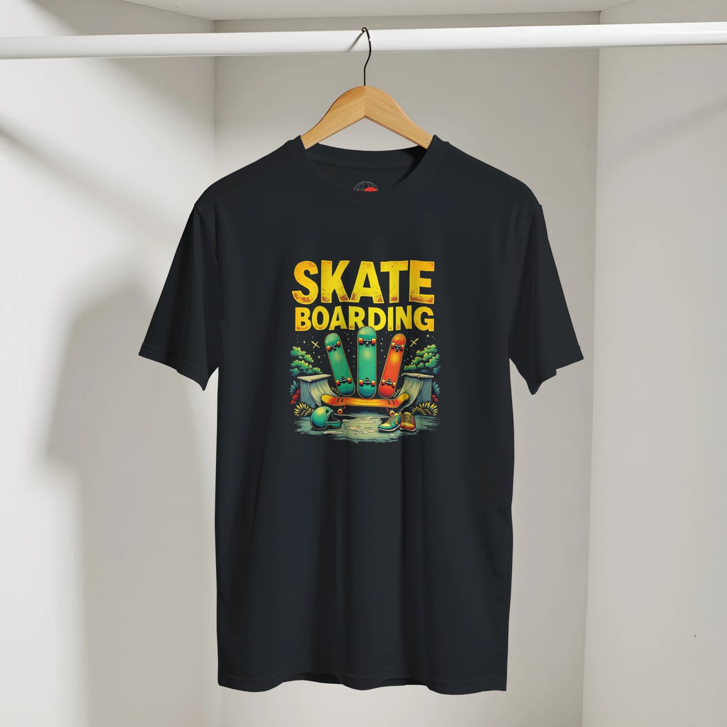 Black t-shirt with 'Skate Boarding' graphic and text on a hanger against a white wall.