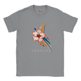 Sports Grey T-shirt displaying a pink hibiscus flower with sweeping navy and gold abstract shapes and UNBOUND lettering.