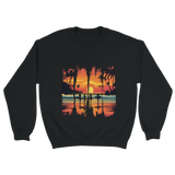 A black unisex sweatshirt featuring a vibrant tropical sunset design with silhouettes of surfers walking along a beach. The graphic includes palm trees, an orange and pink sky, and artistic brushstroke edges, creating a modern coastal vibe. Ideal for beach lovers, surfers, and casual fashion fans.

