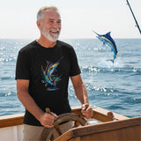 Man on a boat wearing a black t-shirt with a fish design, with a marlin graphic in the water.