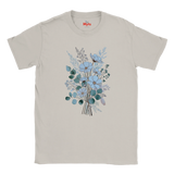 A light beige crewneck t-shirt featuring a central graphic of a floral bouquet with light blue flowers, green leaves, and a butterfly. The brand name 'Myts' is printed in red inside the collar.