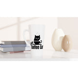 A white ceramic latte mug with a black graphic of a cat in a coffee cup and the text 'LOVE Coffee Cat' printed on the side, styled on a white surface next to books and two ceramic vases.