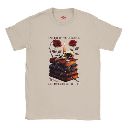 Natural t-shirt with a graphic design of books, roses, and candles on a white background.