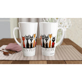 Two white ceramic latte mugs with handles, featuring a graphic of black, orange, and red cats wearing suits and the text 'YES PLEASE' printed below, displayed on a checkered placemat on a wooden table.