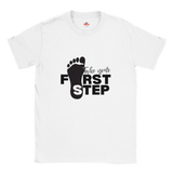 White t-shirt with black footprints and text 'Take your First Step' on a white background