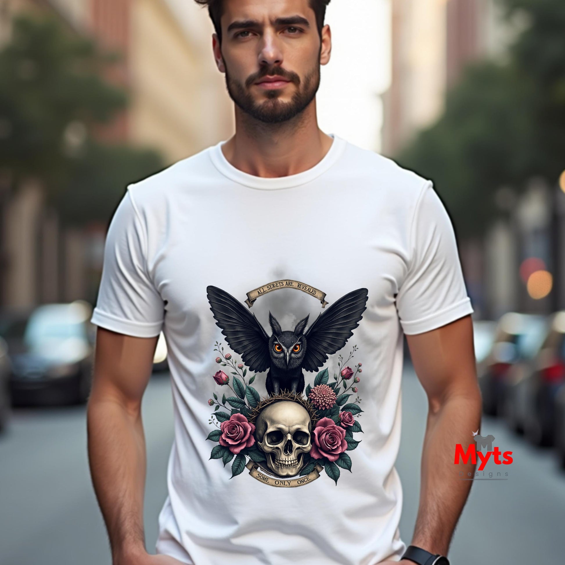 Man wearing a white t-shirt with a black owl and skull design on a city street.