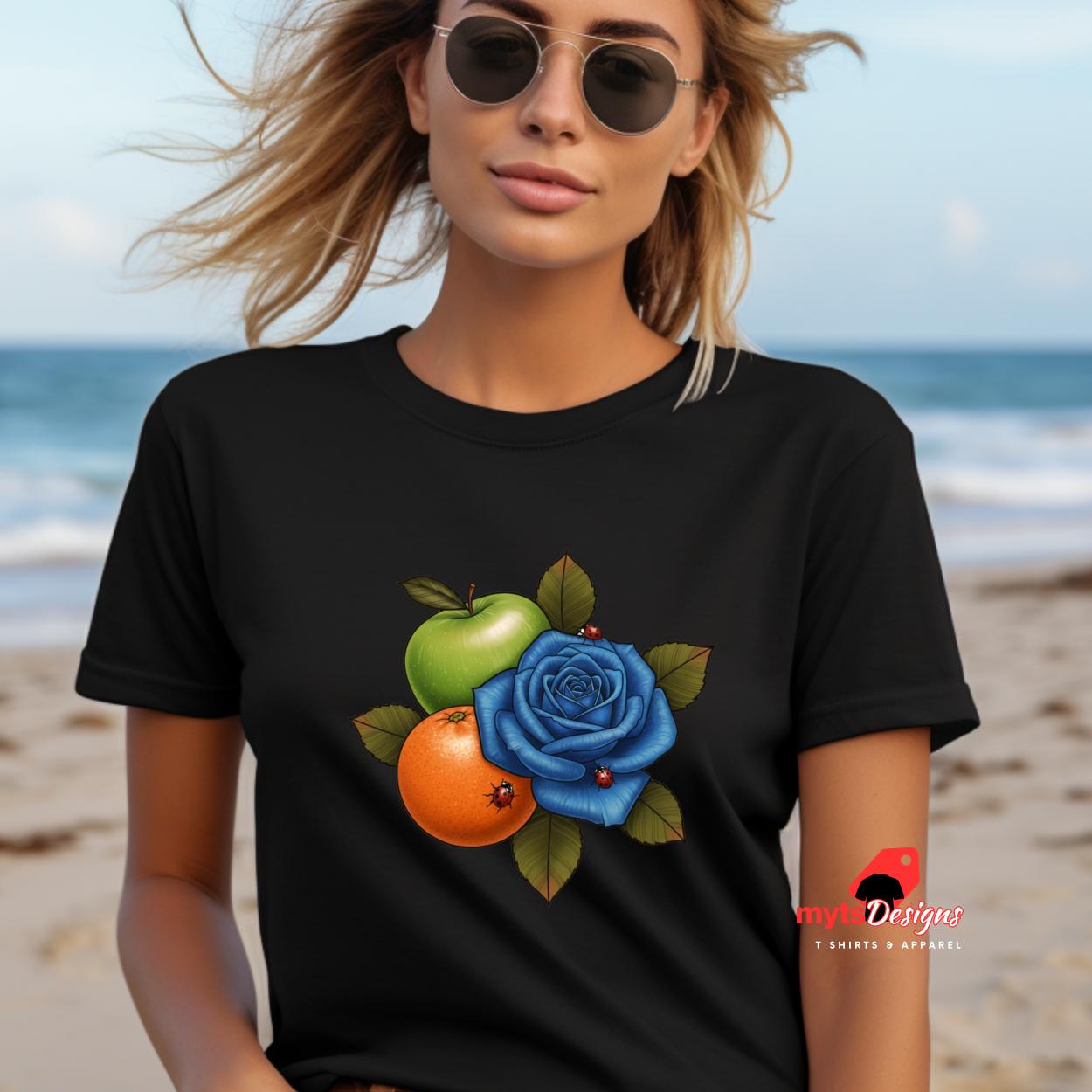 Woman wearing a black t-shirt with a colorful design on a beach