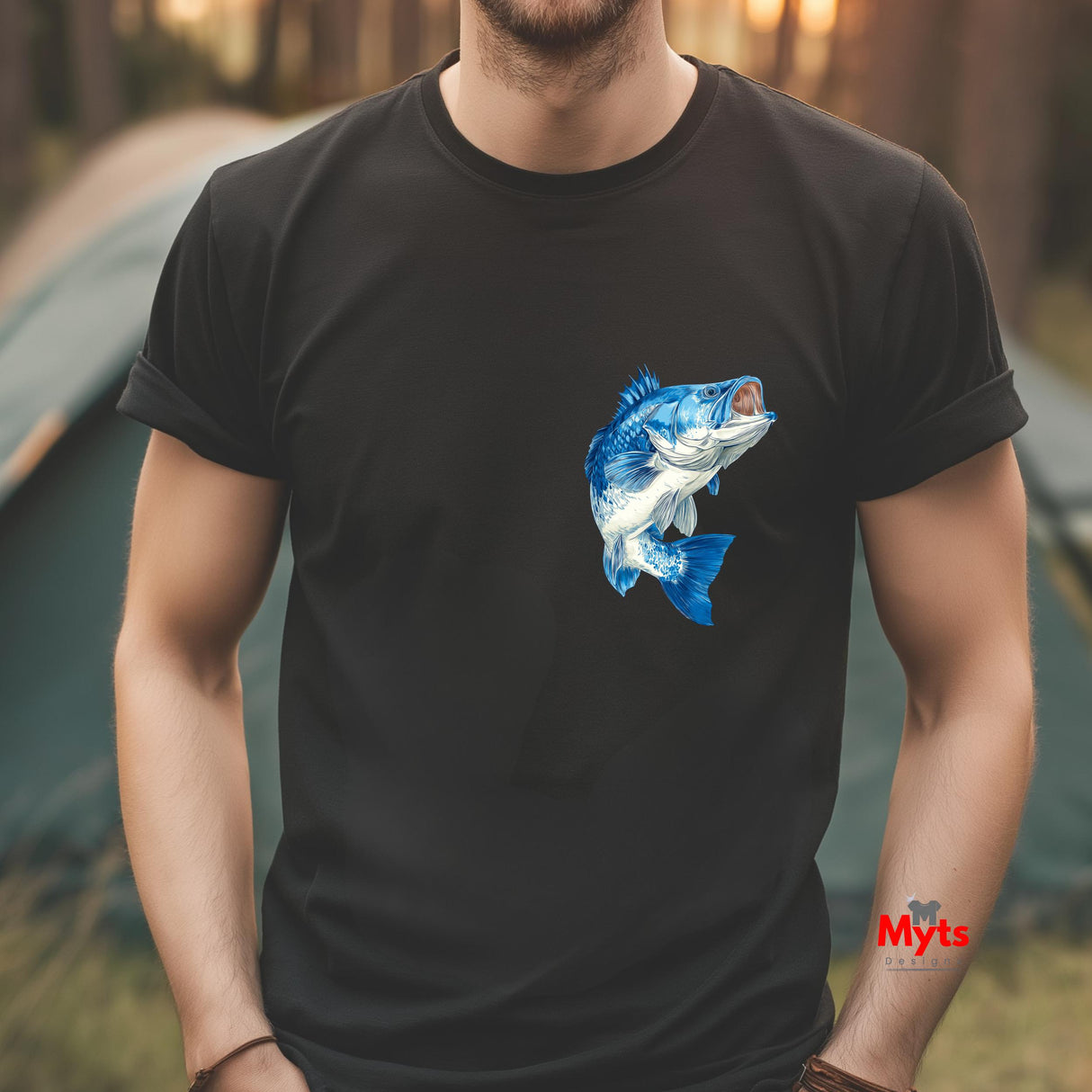 Person wearing a black t-shirt with a blue fish graphic, standing outdoors.