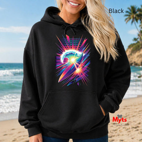Person wearing a black hoodie with a colorful graphic design on a beach