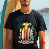 Person wearing a black t-shirt with a surfboard and palm tree design, standing by a surfboard on a beach.