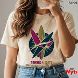 Person wearing a sand t-shirt with a colorful graphic and 'Break Limits' text, holding a phone.