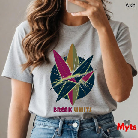 Person wearing a Ash t-shirt with a colorful graphic and 'Break Limits' text, holding a phone.