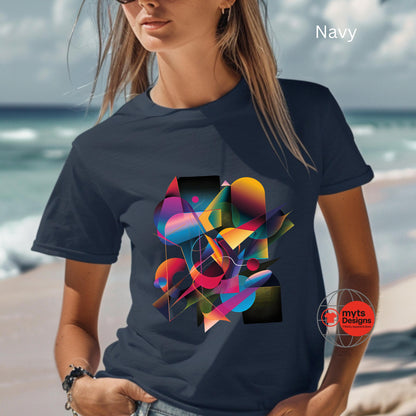 Person wearing a navy t-shirt with a colorful abstract design on a beach.