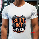 Person wearing a white t-shirt with 'Built Not Given' graphic design.