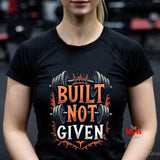 Person wearing a black t-shirt with 'Built Not Given' graphic and barbell design.