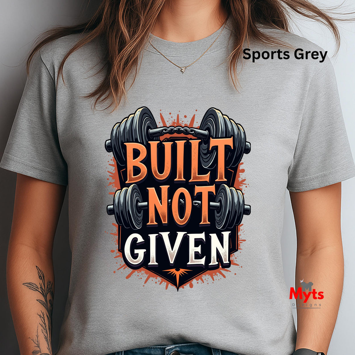 Person wearing a sports grey t-shirt with 'Built Not Given' graphic design.