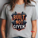 Person wearing a sports grey t-shirt with 'Built Not Given' graphic design.