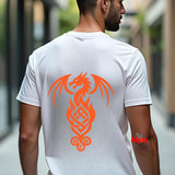 A man viewed from behind wearing a white t-shirt with a large orange dragon graphic printed on the back, set against a blurred outdoor background.