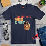 Flat Lay view, Retro-style casual tee featuring bold vintage script reading “Certified Nuts, No Need to Panic” in distressed lettering, printed on a navy ultra-soft Gildan 64000 cotton.

