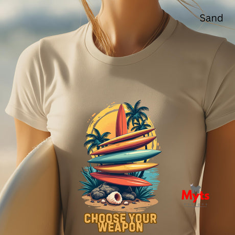 T-shirt with a tropical design featuring surfboards and palm trees, worn by a person.