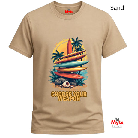 Sand t-shirt with a graphic of surfboards and palm trees and text 'Choose Your Weapon' on a white background.
