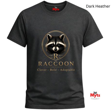 A dark heather charcoal gray t-shirt with a graphic of a raccoon's face and the text 'RACCOON STAY WILD' in a metallic gold tone. The brand name 'Myts' is visible on the inner neck label and as a watermark logo in the bottom right corner.
