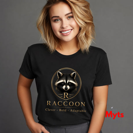 A woman wearing a black graphic t-shirt with a gold raccoon logo and the text 'RACCOON Clever - Bold - Adaptable' on a gray background.