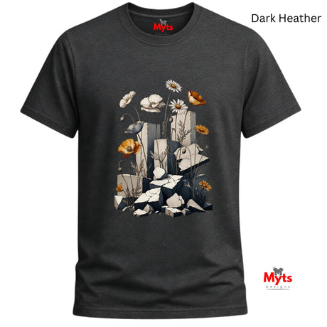 A dark heather gray t-shirt with a graphic print of white daisies, orange poppies, and a blue bird on a background of stacked gray stones. The brand name 'Myts' is printed in red on the inside neck label and in a watermark in the bottom right corner.