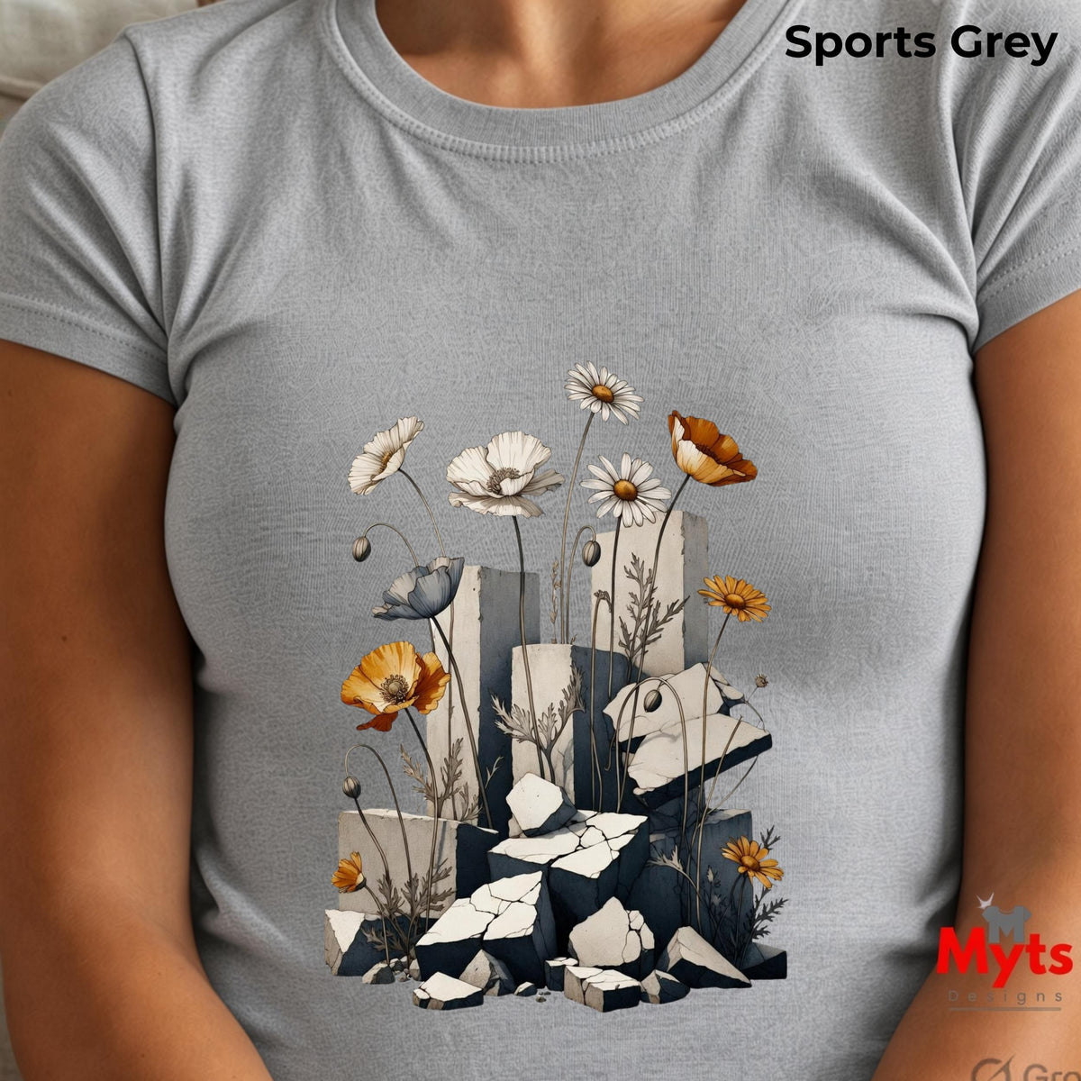 A light grey crewneck t-shirt featuring a graphic print of white daisies, orange poppies, a small bird, and broken grey blocks, shown on a model. The text 'Sports Grey' is visible in the top right corner.