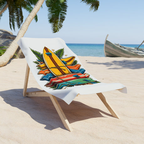 Beach towel with surfboard design on a wooden chair at the beach